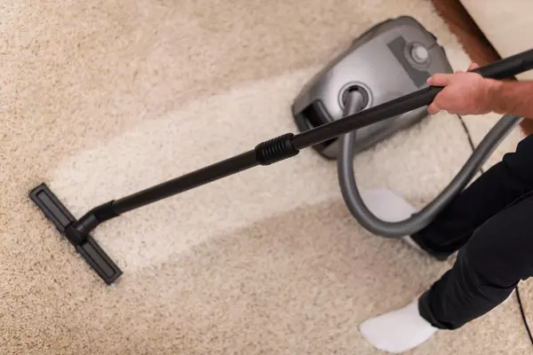 Carpet & Upholstery Cleaning Services - JSS Mewah Person Cleaning Carpet With Vacuum