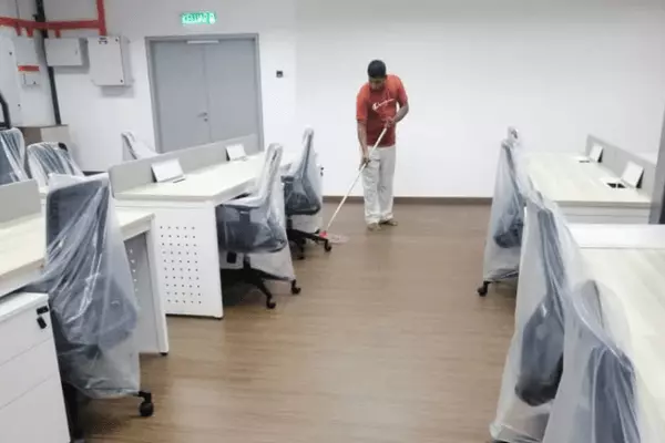 Floor Cleaning and Polishing Cleaning Services - JSS Mewah cleaner doing his cleaning on a office